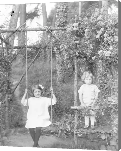 Two Edwardian children in a garden, Mid Wales