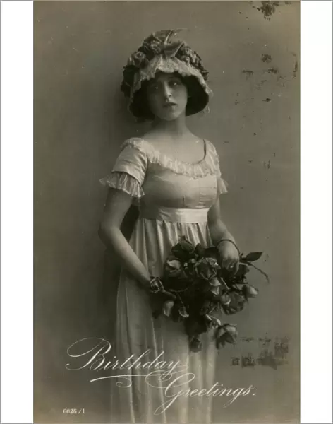 Young woman with roses on a birthday postcard