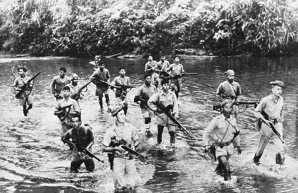 Allied scouts cross a Burmese Jungle stream