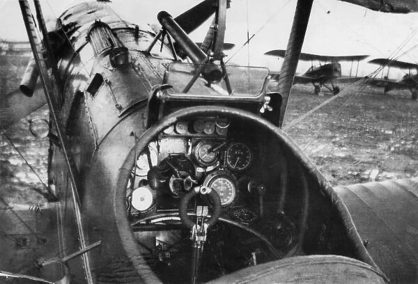Cockpit of British SE5A biplane on airfield, WW1