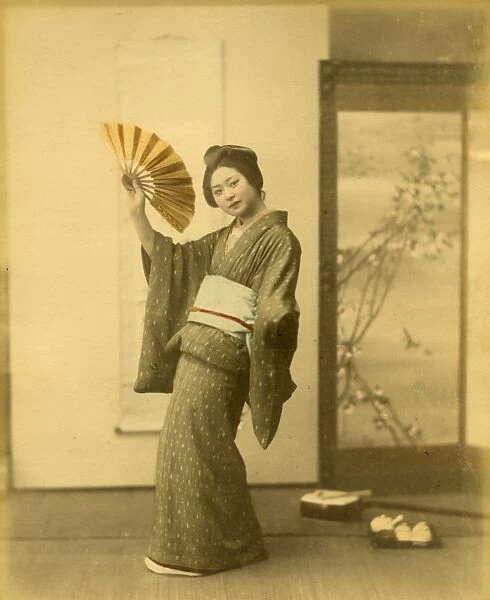 Japanese woman in kimono with fan