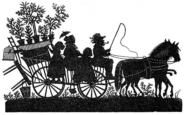 Silhouette - Family riding on a wagon