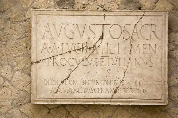 Europe, Italy, Campania, Herculaneum. Sign dedicating the Hall of the Augustals to Emperor Augustus