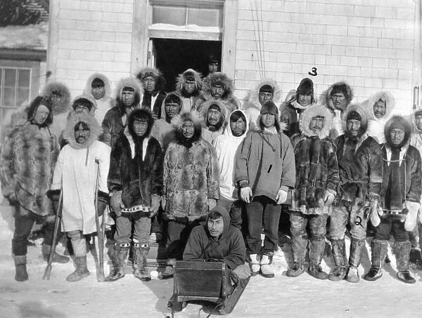 ALASKA: ESKIMOS, c1916. A group of Eskimo men outside of a building, Kivalina, Alaska