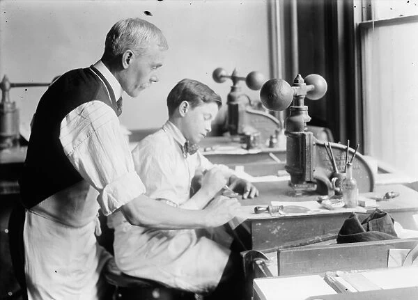 HINE: EMBOSSING SHOP, 1917. 14-year-old Fred cutting dies in Harry C. Taylors embossing shop