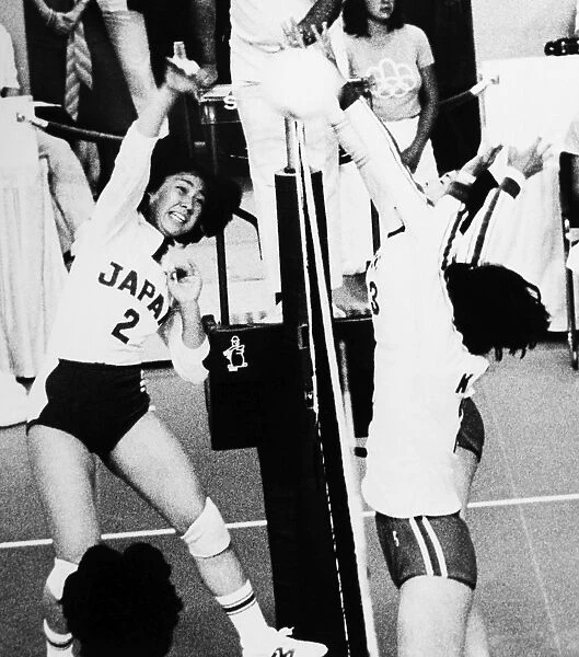 OLYMPICS: VOLLEYBALL, 1976. Mariko Okamoto of Japan spikes the ball past Kyungja Byon and Junghye Yu of South Korea a match during the Summer Olympics in Montreal, Canada. Photograph, 1976