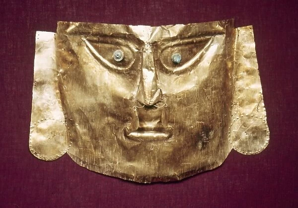 PERU: CHIMU GOLD MASK. Gold mummy mask made by the Chimu culture of ancient Peru, 13th to 15th century A. D