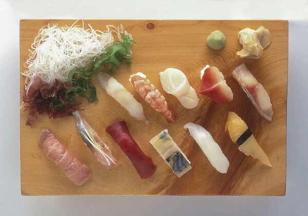 Nigiri-zushi, sushi platter including selection of raw fish laid over blocks of rice, view from above
