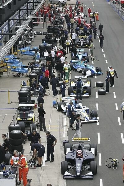2005 GP2 Series - Great Britain: GP2 Cars wait in the pits for the start of Qualiflying