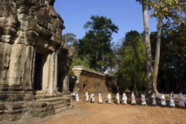 Buy A procession of Buddhist nuns file through the temples of Angkor