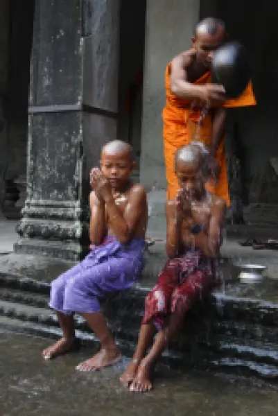 Buy Young Buddhists have their heads shaved as an offering to Buddha
