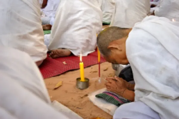 Buy A Buddhist nun prays during a ceremony amongst the temples of Angkor