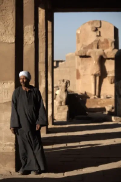 Buy A lone figure stands amongst the Temples of Karnak