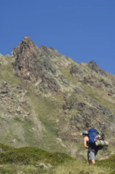 Buy Hiker on climbing trail in hiking area of Pic de Coma Pedrosa