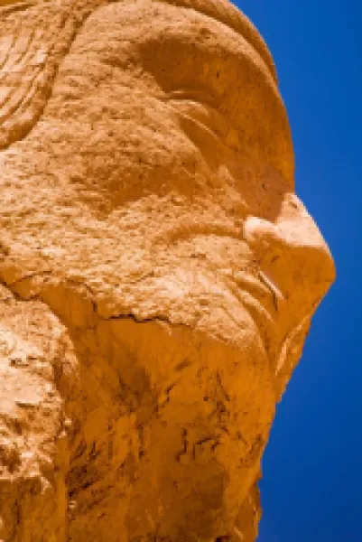 Buy Chile, Atacama Desert, Plaza Quitor. Carved face in the stone wall of the Atacama Desert near the Plaza Quitor.