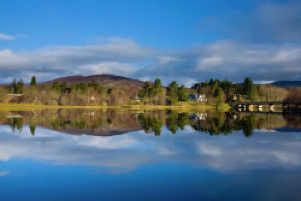 Buy Scotland, Scottish Highlands, Cairngorms National Park. Mirror like reflections upon Loch Insh near Kincraig.