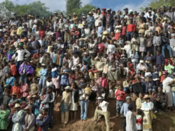 Buy A large crowd of Malagasy people watch a zebu Savika