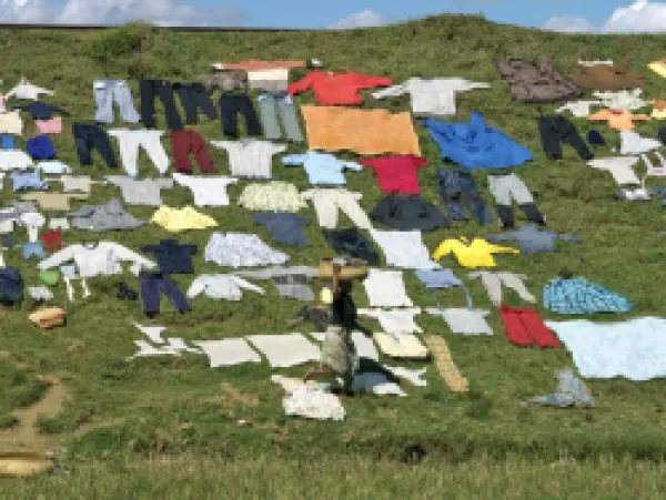 Buy Washing put out to dry on a railway embankment near Antananarivo
