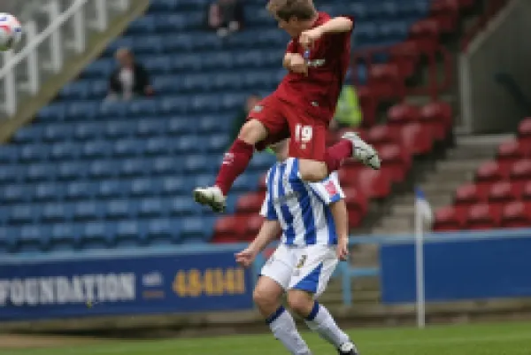 Jake Robinson scores the first of his debut hatrick at Huddersfield