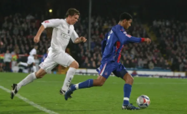 Dean Hammond chases Jobi McAnuff