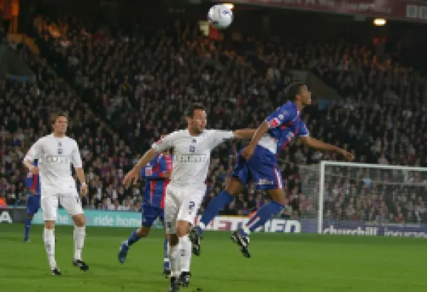 Paul Reid goes up for a header