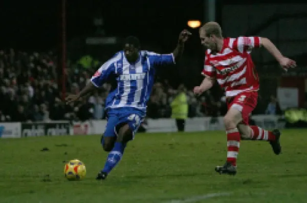 Alastair John, on his Albion debut, takes on Gareth Roberts