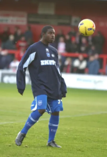 Alastair John warms up before the game
