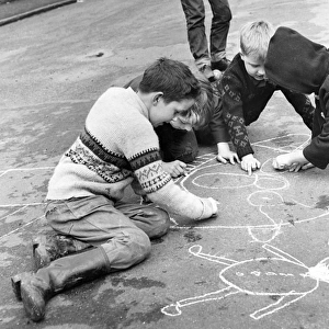 Boys drawing in chalk, Balham, SW London