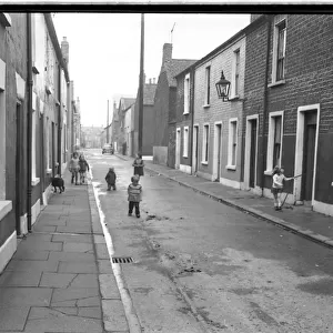 Dog and children in a street, Belfast, Northern Ireland
