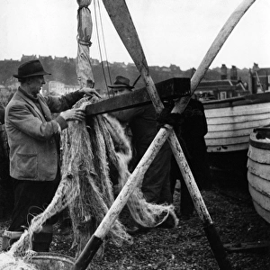 Drying fishing nets at Hastings, Sussex