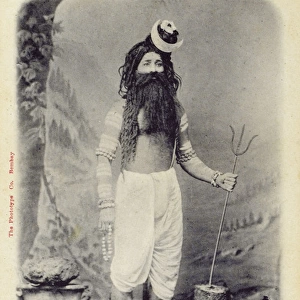 India - A Hindu Man dressed as the Hindu God Lord Shiva