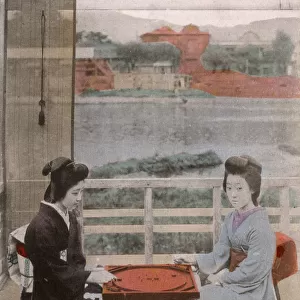 Two Japanese Geisha girls playing crokinole