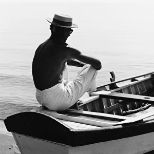 Man Sitting in a Boat