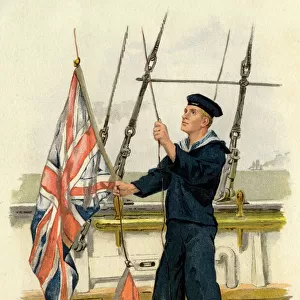Royal Navy sailor with Union Jack and Red Ensign flags
