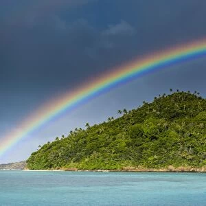 Incredble rainbow over an islet off Ofu Island, Manua Island group, American Samoa, South Pacific, Pacific