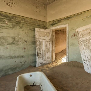 Africa, Namibia, Kolmanskop. Bathtub inside one of the abandoned buildings