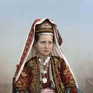 BETHLEHEM: WOMAN, c1895. Young woman from Bethlehem in traditional costume. Photochrome