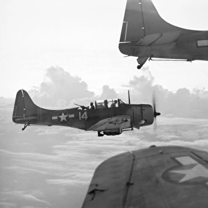 U. S. Navy Douglas Dauntless dive bombers en route to a strike at a Japanese base in the Pacific