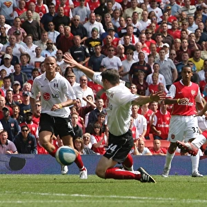 Alex Hleb shoots past Fulham defender Chris Baird to score the 2nd Arsenal goal