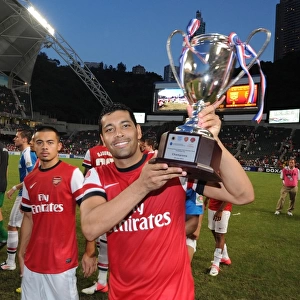 Andre Santos Celebrates with Arsenal's Pre-Season Trophy after Kitchee FC Victory, 2012