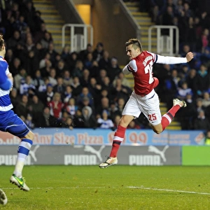 Carl Jenkinson (Arsenal) follows up Theos goal with a shot of his own