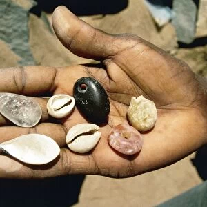 Stone pendants and cowry shells, funerary objects of conical tumulus from Nubian Desert, Sudan