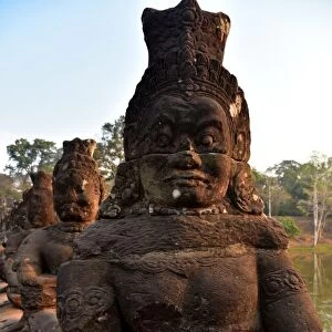 Demons statues alignment Angkor Siem Reap Cambodia