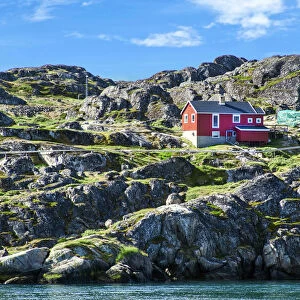 Red house on rocky coastline, Sisimiut, Greenland