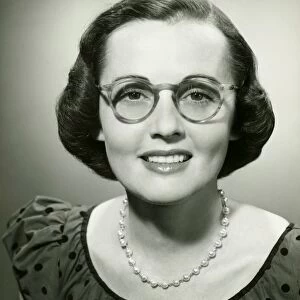 Woman wearing glasses posing in studio, (B&W), (Close-up), (Portrait)