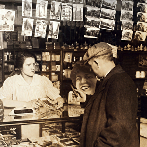 Mary Creed, aged 14, selling cigars, c. 1930 (b / w photo)
