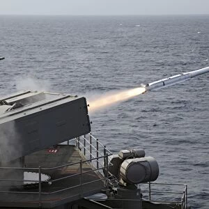 A RIM-7 Sea Sparrow surface missile is launched from the aircraft carrier USS George H