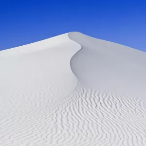 White sand dunes against blue sky, White Sands National Monument, New Mexico, USA