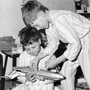 Boys playing with a model plane, c1960s