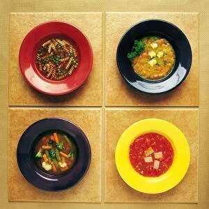 Four Plates Of Different Foods